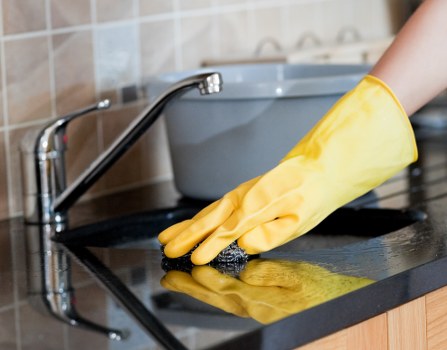 Professional office cleaners working in a Greenwich business reception area
